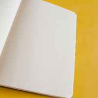 white book page on yellow surface