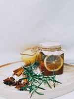photo of jar near cinnamon sticks
