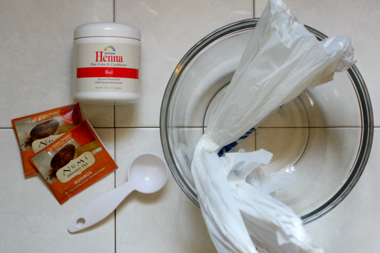 materials you need: glass bowl, plastic spoon, henna powder, tea bags, plastic bag - How to Dye Your Hair with Henna and Tea