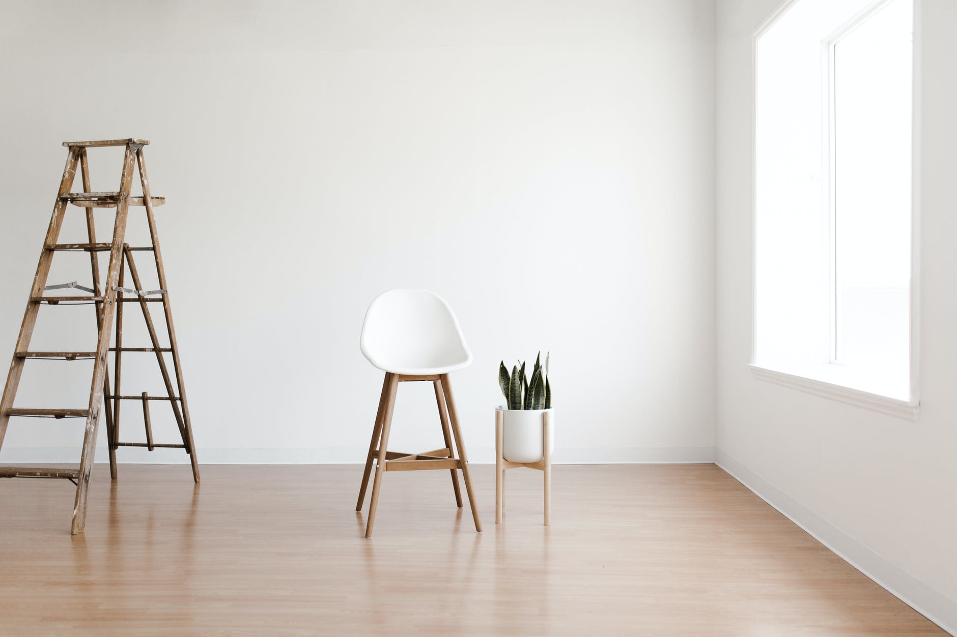 white round table near white wall - Are Minimalists Modern Ascetics?