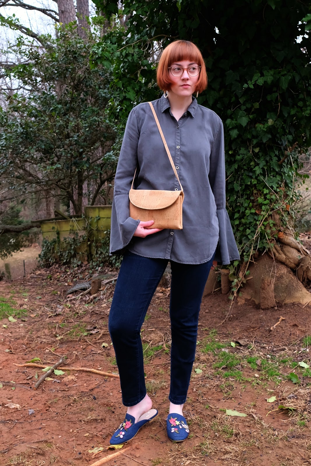 Leah has a bob haircut and wears a bell sleeve gray top and cork purse by EcoVibe - EcoVibe Style EcoFriendly Goods