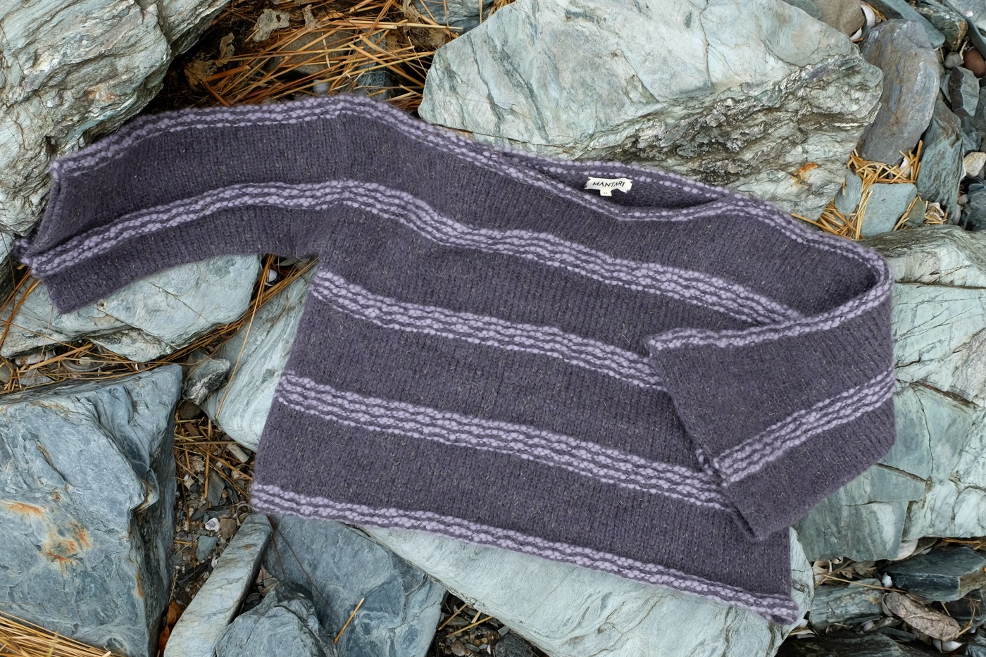 gray alpaca scarf draped on broad rocks - Natural Textiles Spotlight