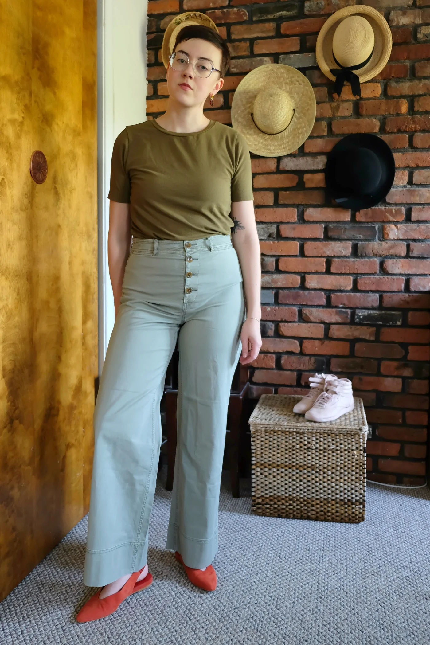  Details: T-shirt -  Universal Standard ; Pants - Lightweight Button-Fly Wide Leg Chino c/o  Everlane ; Shoes -  Everlane  (no longer available -  other colors ); Earring - Repeller 