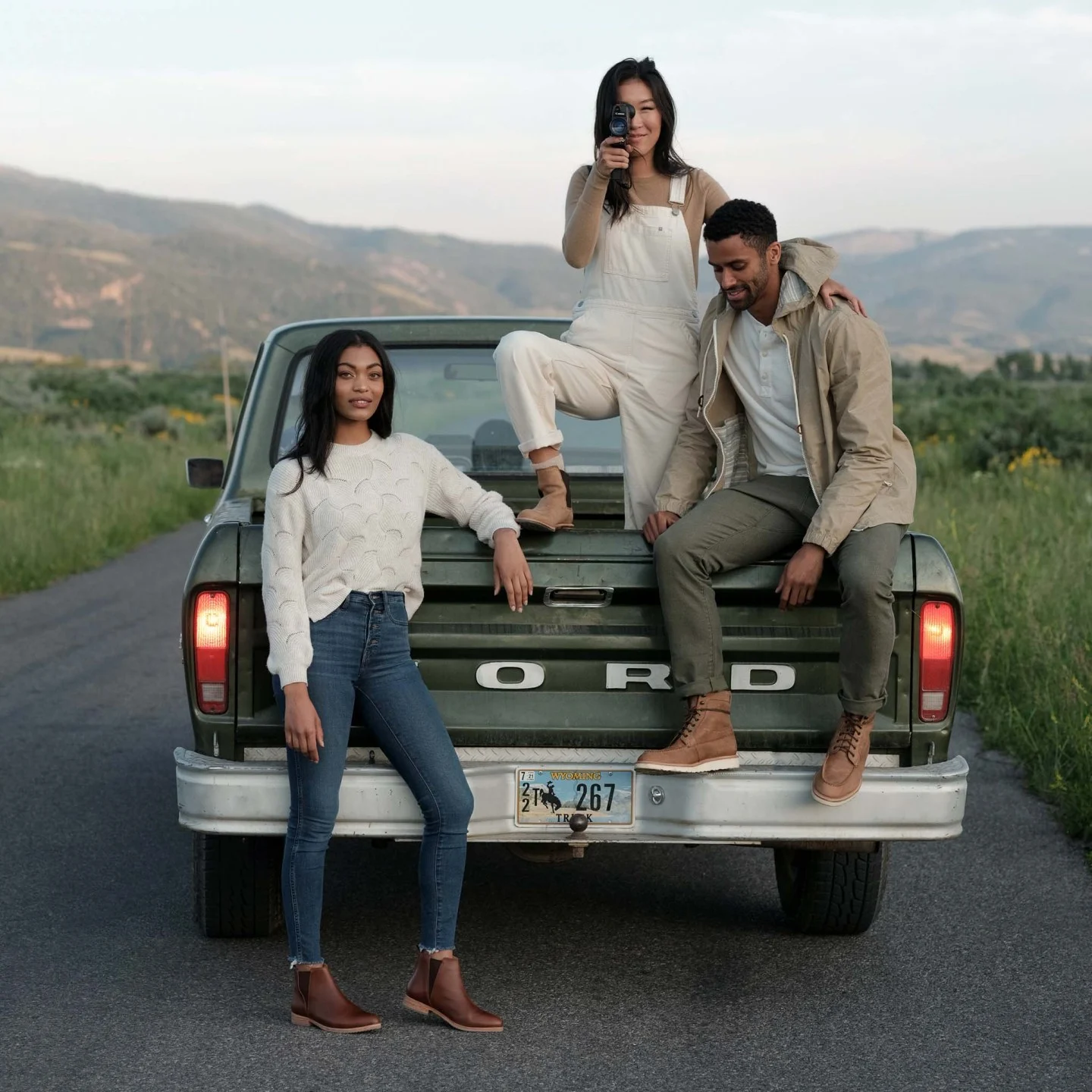 three people stand by truck bed wearing Nisolo shoes - Nisolo Publishes Minimum Wages