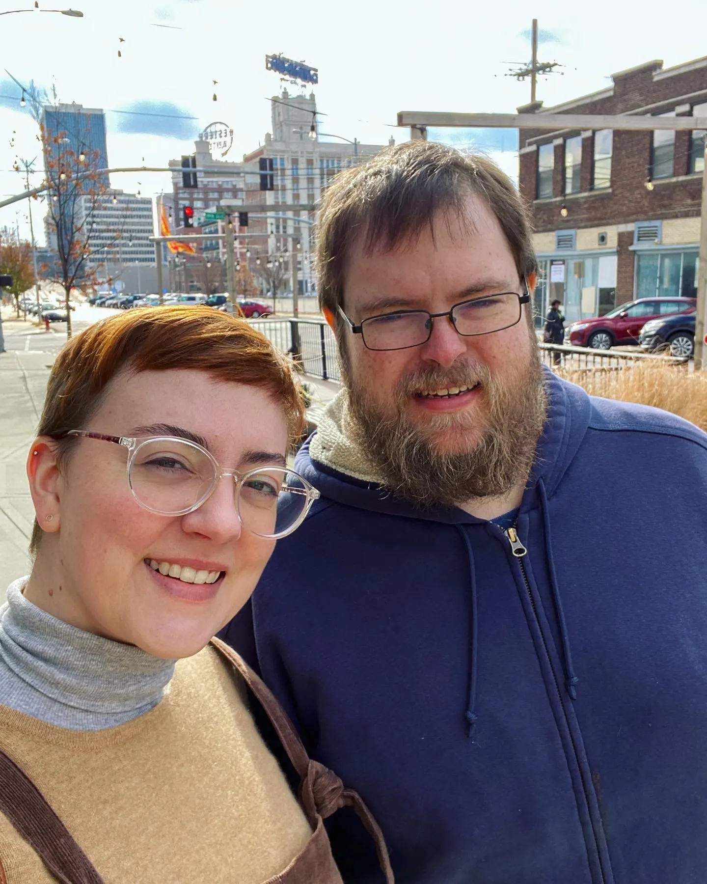 Leah and Daniel stand on street for selfie - 2023 word joy reflection
