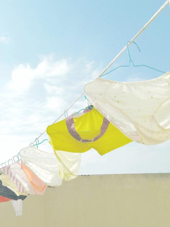 multicolor underwear hanging outside on clothing line - PFAS in Thinx lawsuit